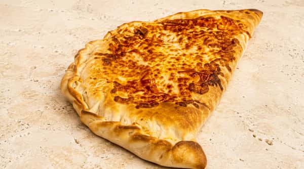 Golden baked calzone filled with Italian-style ingredients from Ciao Bella in Westhill