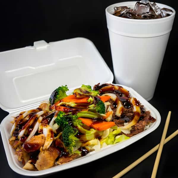 B&C Teriyaki chicken and beef combination plate with rice, broccoli, carrots, cabbage, teriyaki sauce, and an iced drink