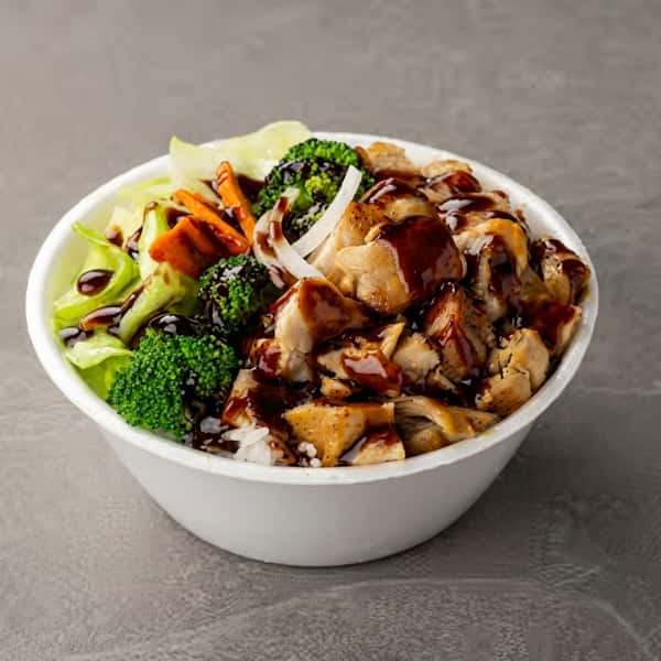Grilled teriyaki chicken rice bowl with broccoli, carrots, cabbage, and onions drizzled with savory sauce