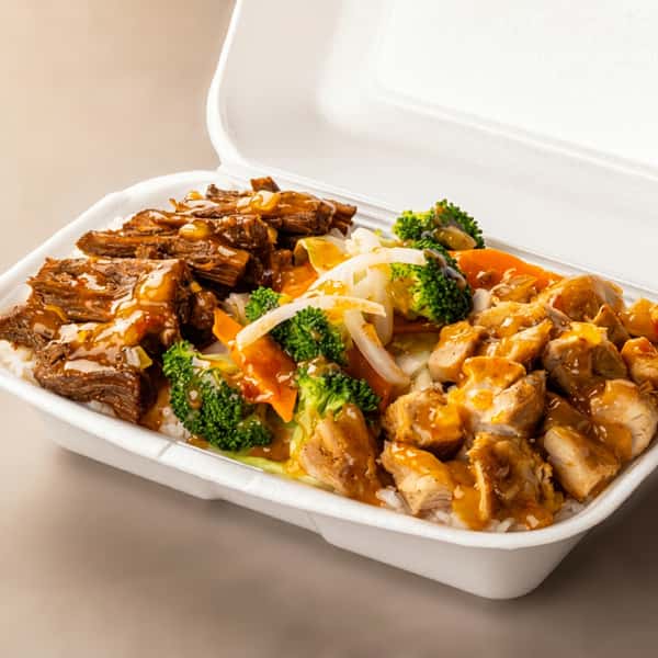 B&C Teriyaki combination plate with beef, chicken, steamed rice, broccoli, carrots, cabbage, and teriyaki sauce