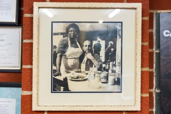Framed old photograph on wall