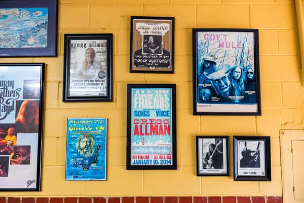 Frames with magazine covers on a wall