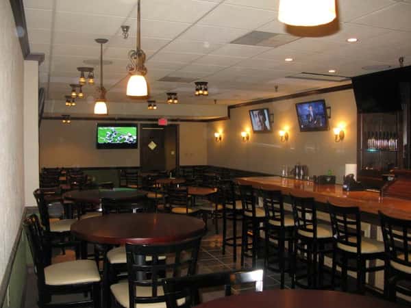 Interior shot of the bar showing tables and chairs