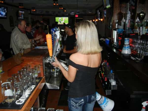 Bartenders serving behind the bar