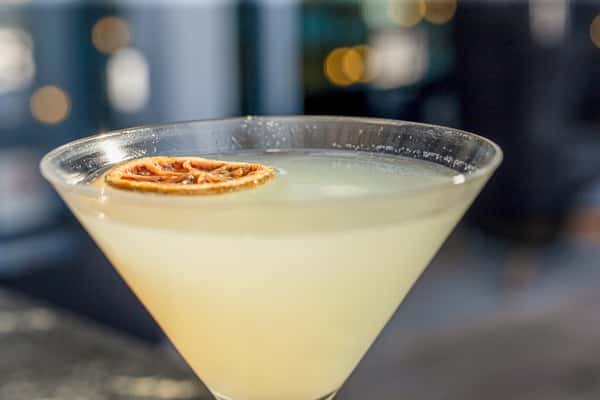 Citrus-garnished martini at Whiskey Charlie rooftop cocktail lounge overlooking The Wharf in Washington, DC