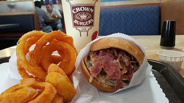 bacon burger, drink, and side of onion rings