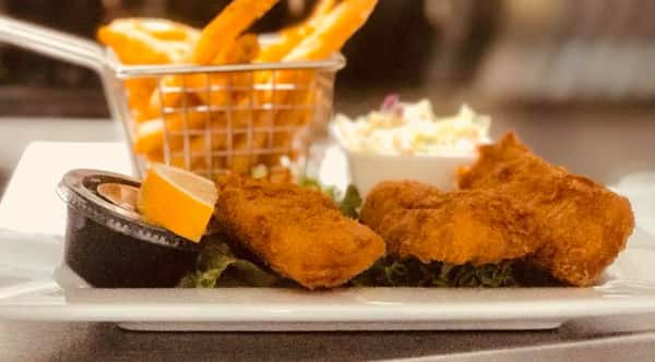 Golden Fried Shrimp Basket with a lemon, coleslaw, and side of fries