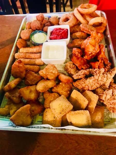 Appetizer sampler with Fried Cheese Sticks, Breaded Mushrooms, Veggie Egg Rolls, Toasted Ravioli, Golden Chicken Strips, Jumbo Buffalo Wings, and Battered Mac and Cheese Bites