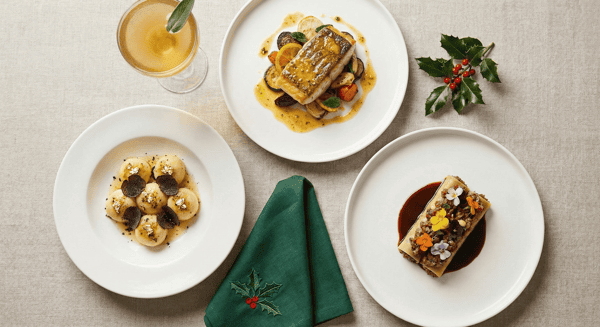 Trio of festive holiday dishes from Stubborn Seed's Christmas Prix-Fixe menu with elegant presentation.