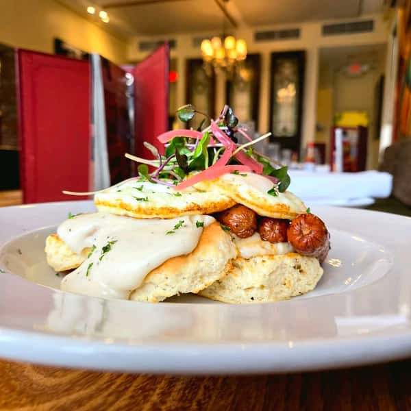 We’re starting Friday with the serious stuff. 🍳

Buttermilk biscuits. Black pepper sausage gravy. Maple chicken breakfast sausage. Two over medium eggs. Pickled red onions.

Friday brunch is on at Lou Lou on Market.