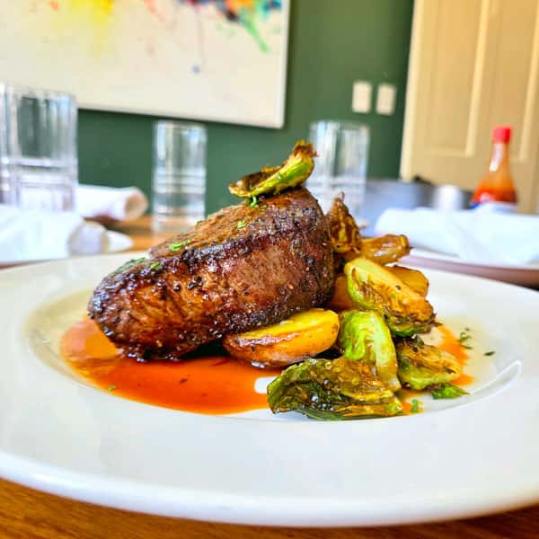 Friday night is calling for steak. 🥩

Tonight’s special is an 8 oz filet over garlic roasted fingerling potatoes with crispy Brussels sprouts, finished with rich demi glace.

Come hungry. Stay for live music on the patio from 6–9 PM.