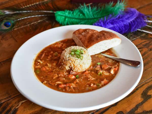 Lou Lou on Market's signature jambalaya—loaded with tender chicken, smoked sausage, and peppers in a bold Creole tomato base. Served with white rice and fresh focaccia, it's a plate full of Louisiana heat and heart.