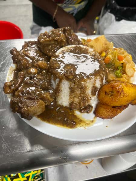 meat with sauces and plantain