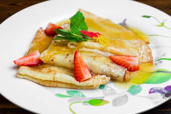 Crepes Suzette with Almond Cream topped with Orange Zest Sauce