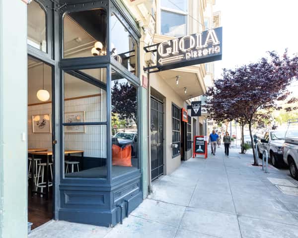 Exterior door entrance leading into Gioia Pizzeria