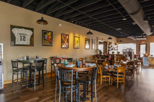 Interior dining space with wooden finishes and warm lighting