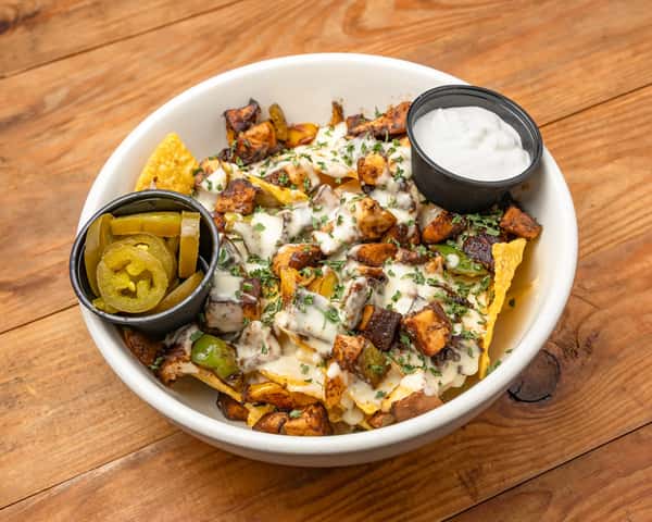 Chip and fries with sauce and pickles