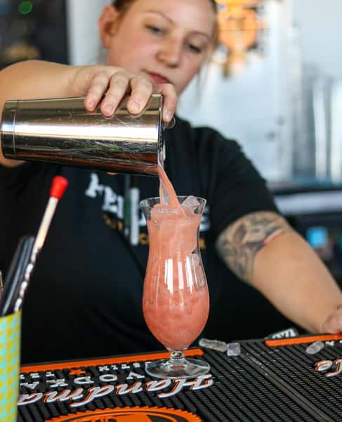 bartender pouring a drink
