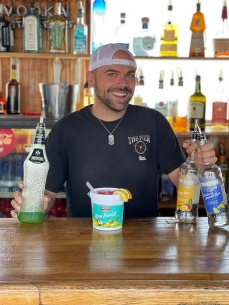 Employee holding drinks at The Pier Patio Pub