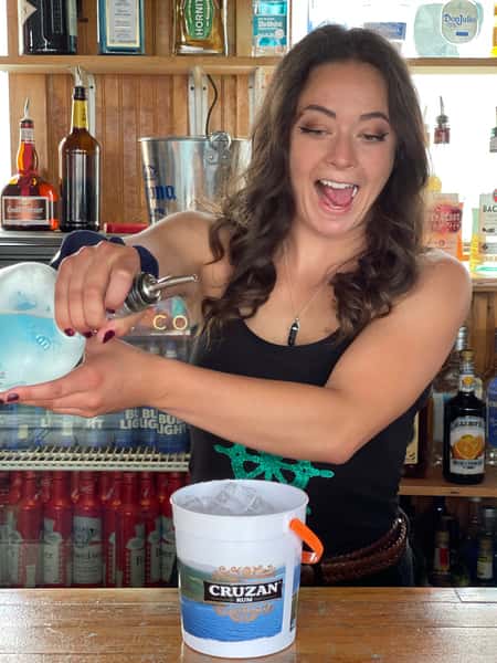 Employee holding drinks at The Pier Patio Pub