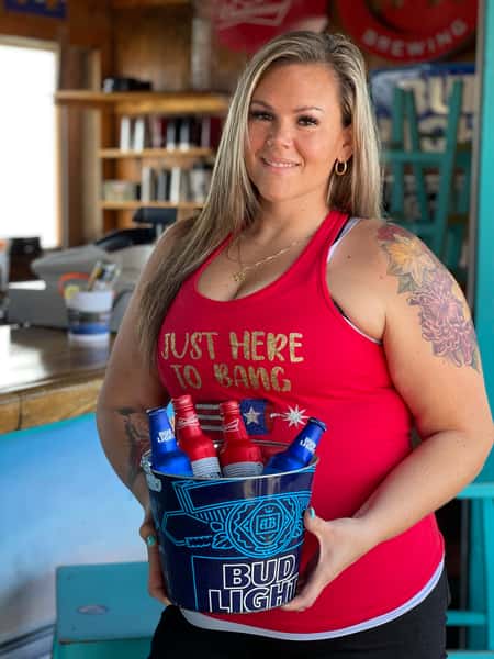Employee holding drinks at The Pier Patio Pub