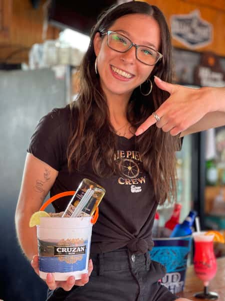 Employee holding drinks at The Pier Patio Pub
