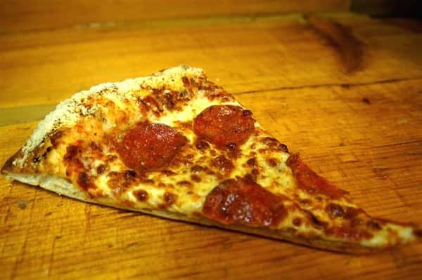 slice of pepperoni pizza on the table