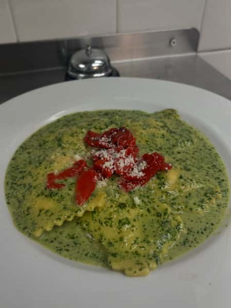 Chefs creamy pesto cheese ravioli as part of our weekend dinner features from 3-8!