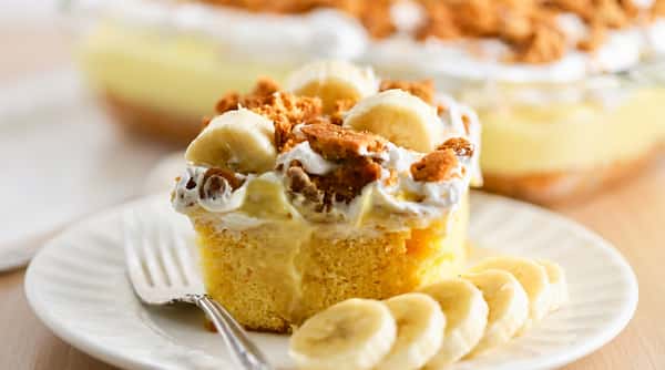 Banana pudding with whipped cream, vanilla wafers, and fresh banana slices.