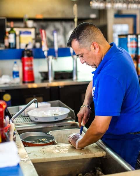 Man in blue working