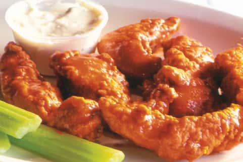 Fried seafood served with celery and a dipping sauce