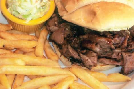 Philly burger served with French fries and side salad