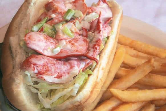 Meat sandwich served with French fries