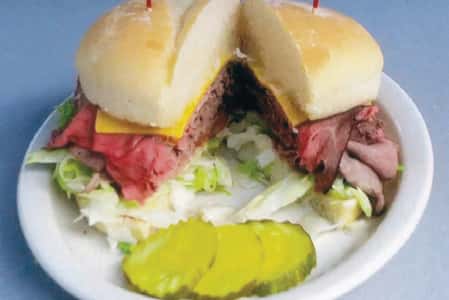 A Burger served with pickles