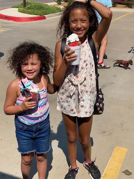 young girls holding shaved ice