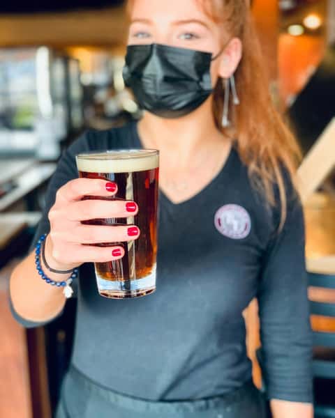 waitress holding beer