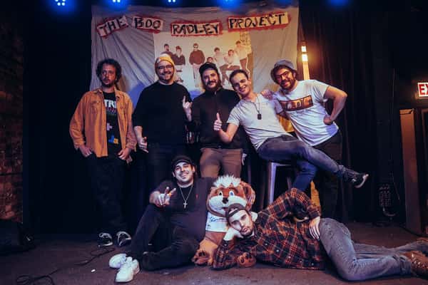 seven band members posing 