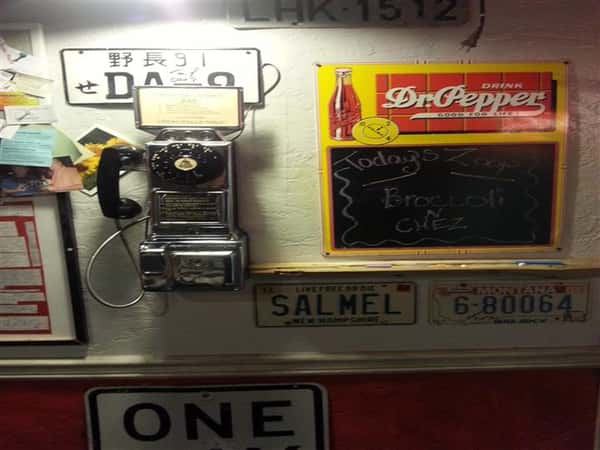 Vintage pay phone and license plates