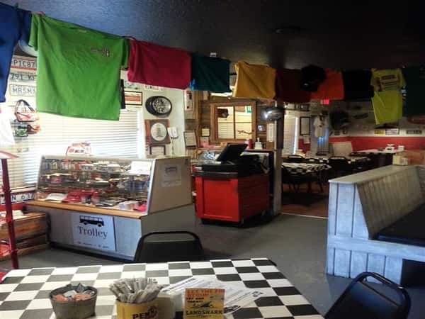 Dining area with T-shirts hanging above
