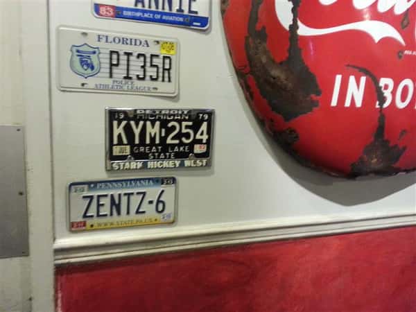 Wall filled with license plates decorations