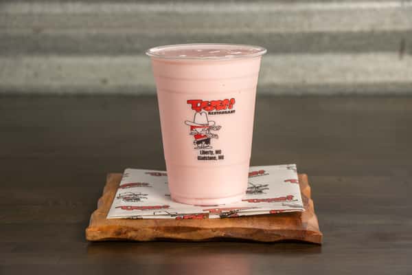 Creamy cherry milkshake served fresh at Texas Tom's