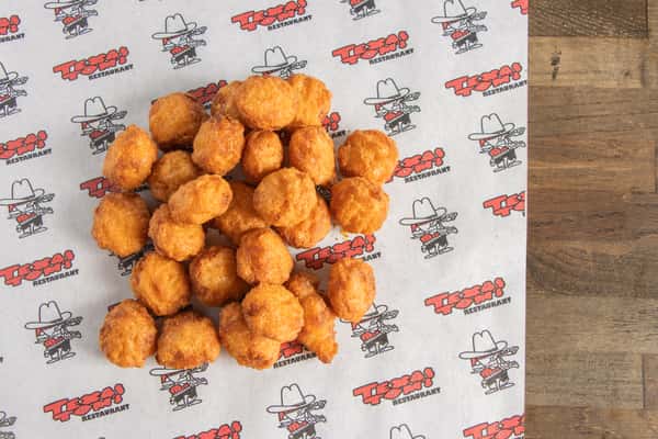 Texas Tom's golden crispy corn nuggets served fresh