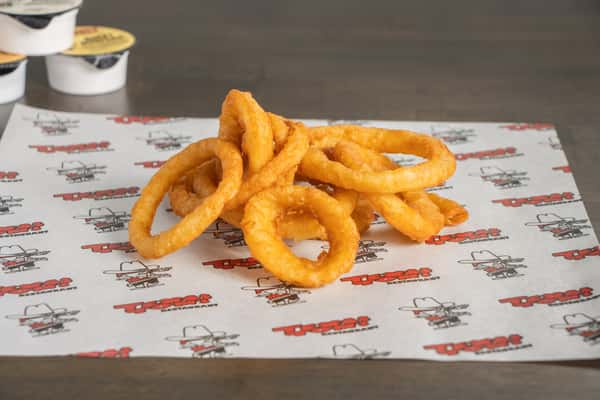 Texas Tom's golden crispy onion rings served fresh