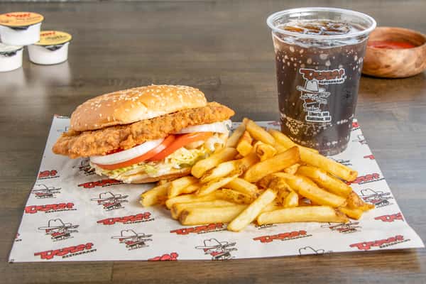 Texas Tom's crispy tenderloin sandwich combo with fresh toppings, fries, and a soft drink