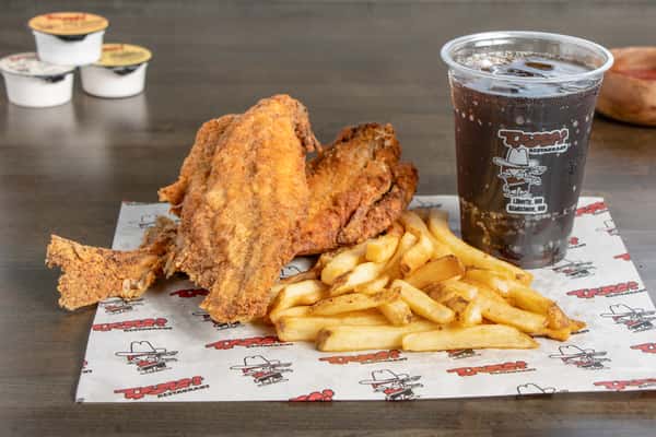 Texas Tom's two-piece crispy bone-in fish basket with fries and a soft drink