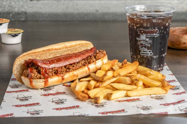 Texas Tom's chili dog combo with a loaded hot dog, crispy fries, and a soft drink
