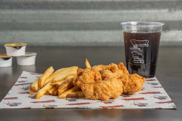 Texas Tom's mild crispy chicken wing basket with seasoned fries and a soft drink