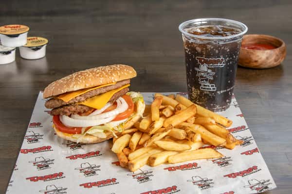 Texas Tom's double cheeseburger combo with fresh toppings, crispy fries, and a soft drink