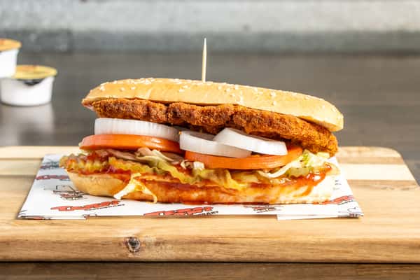 Texas Tom's Italian steak sandwich with seasoned beef, grilled peppers, onions, and melted cheese on a toasted sesame roll