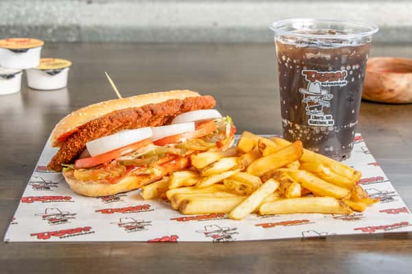 Texas Tom's Philly cheesesteak combo with seasoned beef, melted cheese, crispy fries, and a soft drink